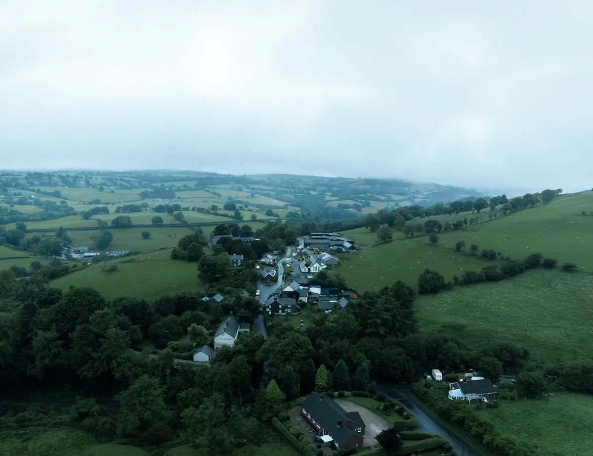 Aerial view of a Welsh village set in green countryside